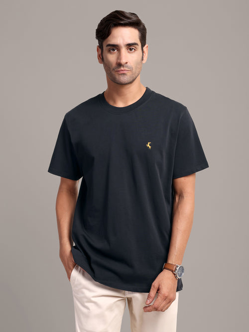 RARE STAG Jet Black Logo Jersey Crewneck T-Shirt – front view on model, studio grey background